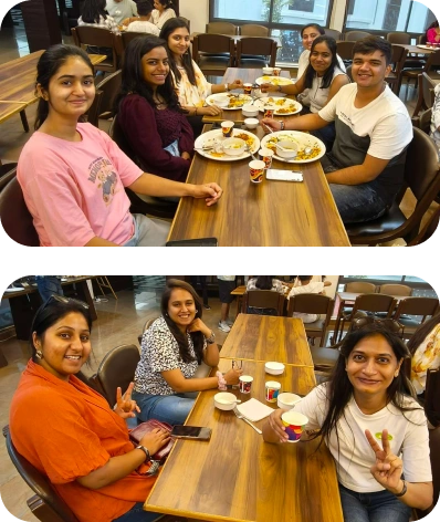 Smiling teammates posing on a high platform during outdoor retreat